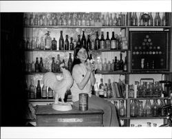 Suzy Mannion and bottle collection of Ed Mannion