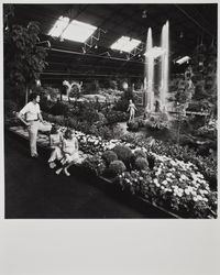 Fair-goers view fountain and pool in the Roman Gardens show at the Hall of Flowers at the Sonoma County Fair, Santa Rosa, California, 1979