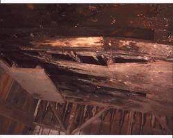 Detail of broken floorboards inside livery stable that stood at the corner of D and First Streets, Petaluma, California, Sept. 25, 2001