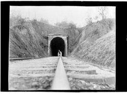 Man standing outside a railroad tunnel near Cloverdale