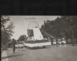 Petaluma egg basket held by women holding streamers, Petaluma, California, about 1923