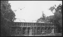 View of an unidentified bridge under construction with old bridge in background