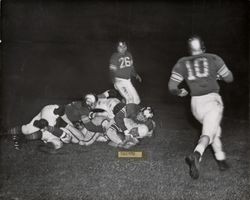 Run play during Petaluma Leghorns game against the Marin Lions