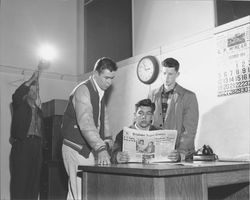 Unidentified boys reading the Petaluma Argus-Courier, Petaluma, California, December 1954