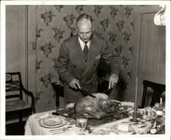 Max Poehlmann carving a turkey, Petaluma, California, about 1947