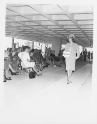 Knee-length, patterned dress modeled at a fashion show at dedication of parking garage at 3rd and D, Santa Rosa, California, 1964