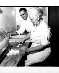 Stan and Minnie Eliot making candy, Petaluma, California, 1952