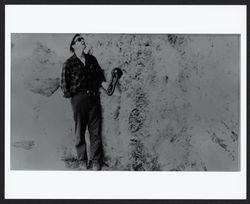 Man demonstrating where ships tied up at the mouth of the Russian River, Jenner, California, August 28, 1969