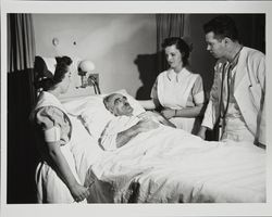 Dr. James C. Dawson and staff attend to a patient