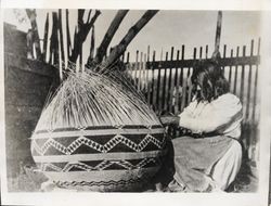 Nellie Burke weaving a no. 3 type twined basket