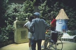 Exhibit and spectators in the Garden of Oz show at the Hall of Flowers at the Sonoma County Fair, Santa Rosa, California, August 1988