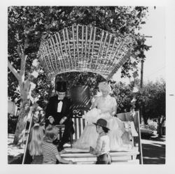 Lorris I. and Ilah M. Dillingham riding on a float in the Centennial Parade, Petaluma, California, July 4, 1976