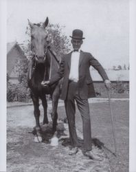 Gustaf Paysen stands by his horse, Petaluma, California, in the 1920s