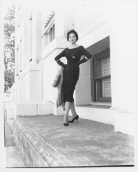 Black cocktail dress and fur stole modeled at the Sonoma County Courthouse, Santa Rosa, California, 1959