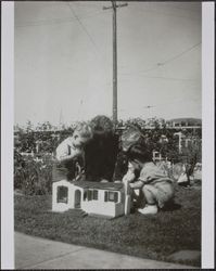 Children with dollhouse at the Spolini home, 200 Dana Street, Petaluma, California, about 1942