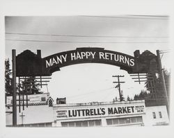 Many happy returns--sign above Luttrell's Market