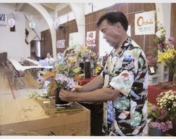 Lance Lew creating a flower arrangement at the Enmanji Temple, Sebastopol, 2014