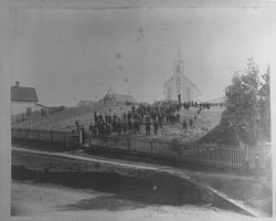 Congregation of St. Teresa's gathered outside the church, along a slope, Bodega, California, 1880