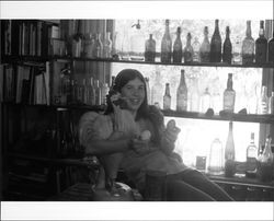 Suzy Mannion and bottle collection of Ed Mannion