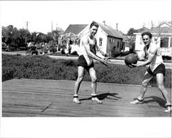 Petaluma Cooperative Creamery basketball team coach Art Spolini and Cecil Clippinger pose for a picture., Petaluma, California, about 1934