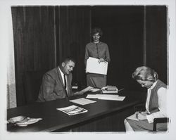 Unidentified Oakmont sales team member from Ray Bellows Realty and assistants, Santa Rosa, California, 1964