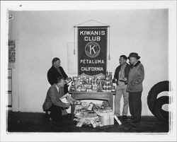 Kiwanis Club members with items for Christmas food and gift drive, Petaluma, California, 1955
