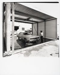 Washing a car at Bishop-Hansel Body Shop, Santa Rosa, California, 1970