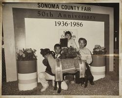 Unidentified exhibitor with his Grand Champion Suffolk lamb at the Sonoma County Fair, Santa Rosa, California, 1986