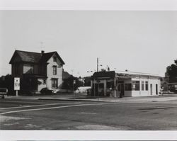 House and gas station located on the west side of Petaluma Boulevard South, at the corner of C Street, Petaluma, California, about 1975