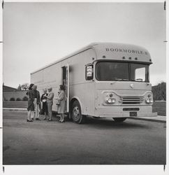 Sonoma County Library Librarian Linda Tucker and a group gathered outside the Bookmobile II at Oakmont, Santa Rosa, California, 1972