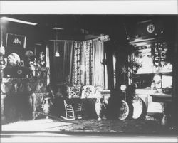 Living room with stone fireplace, Petaluma, California, 1890