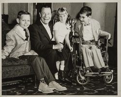 Joe E. Brown with crippled children who participated in the charitable events of the Red Coat Organization, Santa Rosa, California, 1960