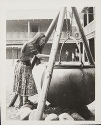 Linda Margarain performs many chores at the Petaluma Adobe, including spinning, grinding corn, candlemaking, baking, etc, Petaluma, California, 1977