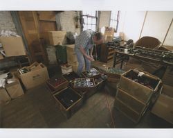 John Agnew inside the Sunset Line & Twine Company building in Petaluma, California, standing next to packing boxes on Dec. 5, 2006