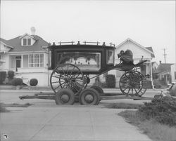 Old hearse parked on Western Avenue in front of Christian Church, Petaluma, California, 1952