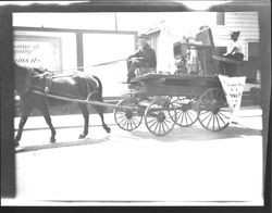 Sewing machine on a wagon being pulled by a horse in a parade, Petaluma, California, 1905