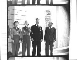 Usherettes with Don Burns, projectionist and Sergius Naify, manager in front of California Theatre., Petaluma, California, 1936