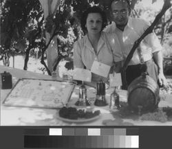 Joe and Livia Vercelli standing behind banquet table at Italian Swiss Colony event in Asti, California