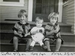 Dorothy, Ray and Marjorie Cochrane sitting on the steps of their house, 415 H Street, Petaluma, California, 1926