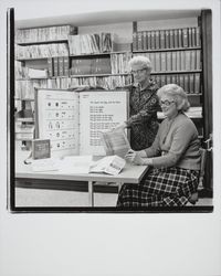 Marian Johnson and Mrs. Peterson, an adult reading teacher with some of the Sonoma County Library language materials, Santa Rosa, California, 1973