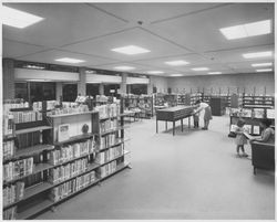 Patrons using the Dagny Juell Boys and Girls Room of the Library