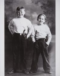 Thomas Herbert Ware and Bobby Mennter play cops and robbers in a photography studio, Santa Rosa, California, about 1930