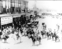 Group gathered on Exchange Avenue--men on horseback in street