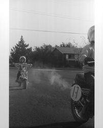 Unidentified people on motorcycles in Petaluma, California, 1973