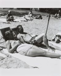 Mary and Bud Alwes, and unidentified people at the beach, Lake Tahoe, 1956