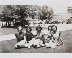 Mary Margaret Thompson and four unidentified women seated on the campus of Santa Rosa High School, Santa Rosa, California, about 1941