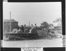 Men at work on cement mixer platform