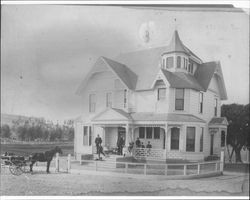 E.W.M. Evans and family standing on the front porch of their newly completed home at 210 West Street, Petaluma, Calif, 1897