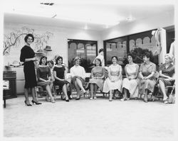 Girls of Conover School trying on clothes at Ceci's, Santa Rosa, California, 1960