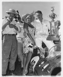 Jayne Mansfield at the car races with car drivers, Santa Rosa, California, 1960